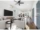Bright living room featuring modern decor, hardwood floors, and a ceiling fan at 100 Dahlia Nw Ave, Atlanta, GA 30314