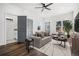 Open-concept living space with comfortable seating, neutral tones, and natural light at 100 Dahlia Nw Ave, Atlanta, GA 30314