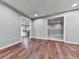 Finished basement area featuring sleek wood floors and multiple access points at 1594 Stoddard Nw Ct, Kennesaw, GA 30152