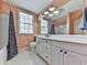 This vintage bathroom features white cabinets, a large mirror and a shower-tub combination at 1594 Stoddard Nw Ct, Kennesaw, GA 30152