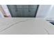 Close-up of a kitchen's stone countertop with natural veining and a sink at 1594 Stoddard Nw Ct, Kennesaw, GA 30152