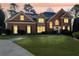 A beautiful brick home with a well-manicured lawn and inviting curb appeal at 1594 Stoddard Nw Ct, Kennesaw, GA 30152