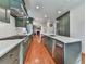 A kitchen featuring a long island, stainless steel appliances, and hardwood flooring at 1594 Stoddard Nw Ct, Kennesaw, GA 30152
