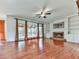 Bright living room featuring hardwood floors, built-in shelves, and fireplace at 1594 Stoddard Nw Ct, Kennesaw, GA 30152