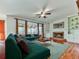 Open-concept living room with hardwood floors, fireplace, and stylish furnishings at 1594 Stoddard Nw Ct, Kennesaw, GA 30152
