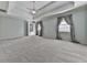 Large primary bedroom with tray ceilings, plush carpeting and an ensuite bathroom at 1594 Stoddard Nw Ct, Kennesaw, GA 30152