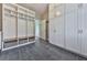 This mud room provides ample storage with large white cabinets and a wooden bench with baskets at 1594 Stoddard Nw Ct, Kennesaw, GA 30152