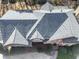 Birds eye view of the roof and its architectural design complemented by the greenery below at 1594 Stoddard Nw Ct, Kennesaw, GA 30152