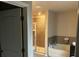 Bright bathroom featuring a walk-in shower and soaking tub at 3604 Sw Wartrace Sw Dr, Atlanta, GA 30331