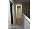 Upstairs hallway with plush carpeting and neutral paint at 3604 Sw Wartrace Sw Dr, Atlanta, GA 30331