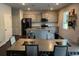 Bright and modern kitchen with an island, stainless steel appliances, and a dining area at 3604 Sw Wartrace Sw Dr, Atlanta, GA 30331
