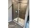 Modern bathroom featuring a glass-enclosed shower with tiled walls and a sleek showerhead at 3604 Sw Wartrace Sw Dr, Atlanta, GA 30331