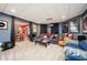 Finished basement with carpet and movie posters plus a view of the adjacent room at 455 Cooper Woods Se Ct, Smyrna, GA 30082