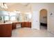 Spacious bathroom with double vanities and sinks, and access to the walk-in closet and water closet at 455 Cooper Woods Se Ct, Smyrna, GA 30082