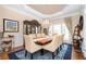 Formal dining room with large table, chandelier, and elegant decor at 455 Cooper Woods Se Ct, Smyrna, GA 30082