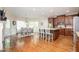 Open kitchen featuring an island with seating, stainless steel appliances, and breakfast nook at 455 Cooper Woods Se Ct, Smyrna, GA 30082