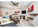 Cozy living room with floating shelves, decorative accents, and a television on the wall at 455 Cooper Woods Se Ct, Smyrna, GA 30082
