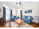 Bright living room with hardwood floors, bay window, and stylish furnishings at 455 Cooper Woods Se Ct, Smyrna, GA 30082