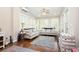Cozy sunroom with lots of natural light, stylish seating and ceiling fan at 455 Cooper Woods Se Ct, Smyrna, GA 30082