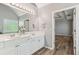 Bathroom with double sink vanity, tile floor and glass block window at 507 Mirramont Pl, Woodstock, GA 30189