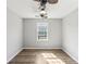 Bedroom featuring wood floors and a bright window at 507 Mirramont Pl, Woodstock, GA 30189