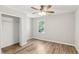 Cozy bedroom with wood-look flooring and a window with natural light at 507 Mirramont Pl, Woodstock, GA 30189