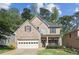 Charming two-story home with a brick front, well-maintained lawn, and a two-car garage at 507 Mirramont Pl, Woodstock, GA 30189