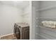 Laundry room with washer, dryer and storage at 507 Mirramont Pl, Woodstock, GA 30189