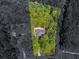 Aerial view of property surrounded by lush, mature trees offering great privacy at 3500 Lost Valley Dr, Jonesboro, GA 30236