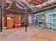 Unfinished basement space with exposed duct work and shelving for storage at 3500 Lost Valley Dr, Jonesboro, GA 30236