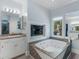 Luxurious bathroom with jacuzzi tub, fireplace, and stylish fixtures at 3500 Lost Valley Dr, Jonesboro, GA 30236