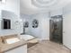 Bright and airy primary bath featuring a jacuzzi tub, walk-in shower and stylish tile at 3500 Lost Valley Dr, Jonesboro, GA 30236