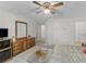 Spacious bedroom with light carpet, ceiling fan, and wooden dresser at 3500 Lost Valley Dr, Jonesboro, GA 30236