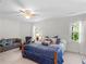 Bright bedroom with a ceiling fan and natural light from two windows at 3500 Lost Valley Dr, Jonesboro, GA 30236
