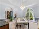 Dining room boasts modern furniture, ample seating, and plenty of natural light at 3500 Lost Valley Dr, Jonesboro, GA 30236