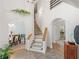 Open foyer with stairway and access to formal dining room with elegant decor at 3500 Lost Valley Dr, Jonesboro, GA 30236