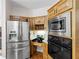 Contemporary kitchen with stainless steel fridge, built-in microwave and oven at 3500 Lost Valley Dr, Jonesboro, GA 30236