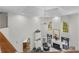 Upstairs landing overlooking a fireplace, aquarium, and comfortable sitting area with natural light at 3500 Lost Valley Dr, Jonesboro, GA 30236