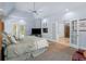 Bright main bedroom with large windows and french doors and a ceiling fan at 3500 Lost Valley Dr, Jonesboro, GA 30236