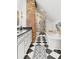 Stylish bathroom with exposed brick accent wall, soaking tub, and a glass-enclosed shower at 1216 Beech Valley Ne Rd, Atlanta, GA 30306