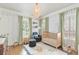 Charming Bedroom with blue striped wallpaper, a cozy crib, and bright natural light from the windows at 1216 Beech Valley Ne Rd, Atlanta, GA 30306