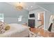 Bright bedroom featuring a skylight, ensuite access, and a full-length mirror at 1216 Beech Valley Ne Rd, Atlanta, GA 30306
