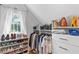 Well-organized closet with custom shelving for shoes, clothing, and accessories at 1216 Beech Valley Ne Rd, Atlanta, GA 30306