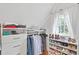 Bright closet featuring custom shelving, ample storage, and natural light from a window at 1216 Beech Valley Ne Rd, Atlanta, GA 30306