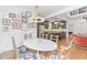 Open concept dining room with green kitchen and hardwood floors at 1216 Beech Valley Ne Rd, Atlanta, GA 30306