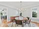 Elegant dining room with hardwood floors, chandelier, and large windows at 1216 Beech Valley Ne Rd, Atlanta, GA 30306