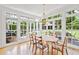 Dining room with windows, hardwood floors, and table with seating at 1216 Beech Valley Ne Rd, Atlanta, GA 30306