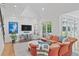 Spacious living room with a vaulted ceiling, a large TV, comfortable seating, and access to a patio at 1216 Beech Valley Ne Rd, Atlanta, GA 30306