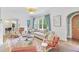 Bright living room featuring hardwood floors, white trim, and an arched doorway at 1216 Beech Valley Ne Rd, Atlanta, GA 30306