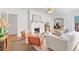 Cozy living room featuring a fireplace, hardwood floors, and comfortable seating at 1216 Beech Valley Ne Rd, Atlanta, GA 30306